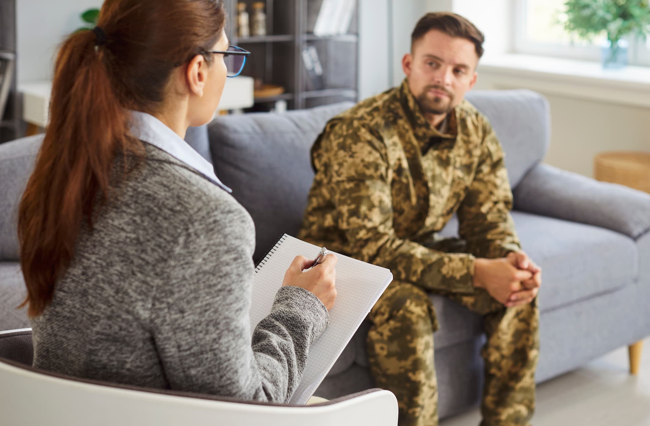 Service member speaking with a therapist